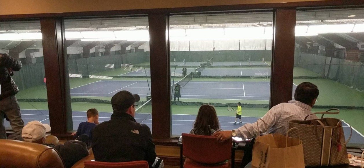Indoor tennis courts at Maywood Racquets Club viewed from the clubhouse